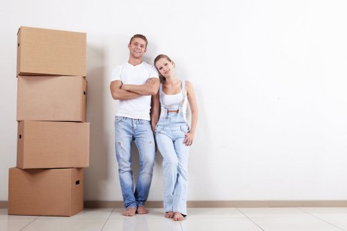 Students moving boxes into a removals van in Bromley