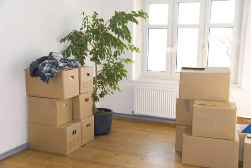 Packed boxes and household items being transported by a local van service